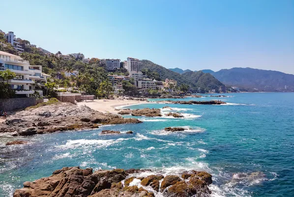 Conchas Chinas Beach near Hyatt Ziva Puerto Vallarta featuring golden sands, clear waters, and picturesque coastal scenery