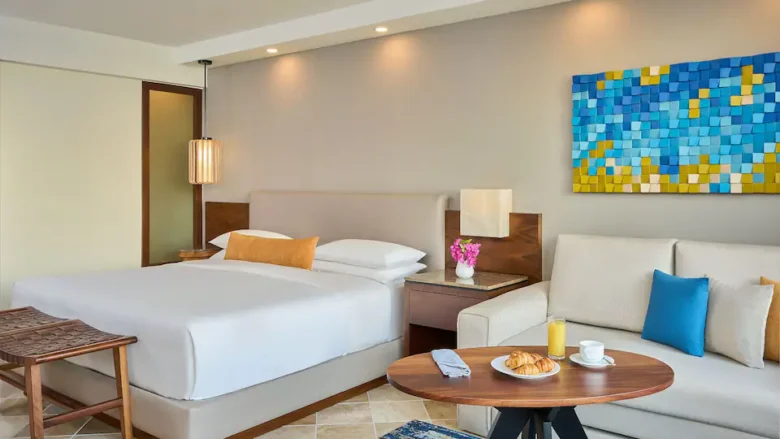 King Garden View room with king bed and seating area at Hyatt Ziva Puerto Vallarta.