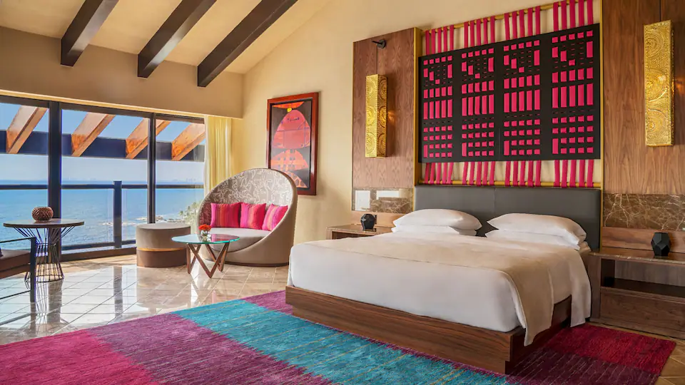 Presidential Suite king bedroom with oceanfront balcony views at Hyatt Ziva Puerto Vallarta.