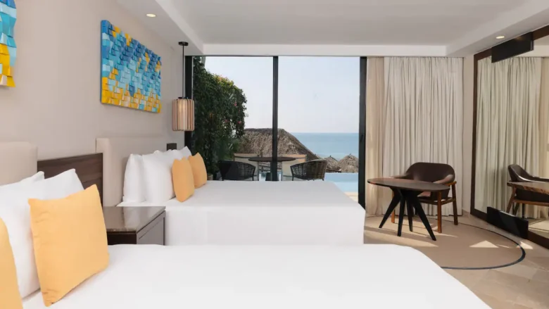 Swim-Up Double room with two double beds and ocean view terrace at Hyatt Ziva Puerto Vallarta.