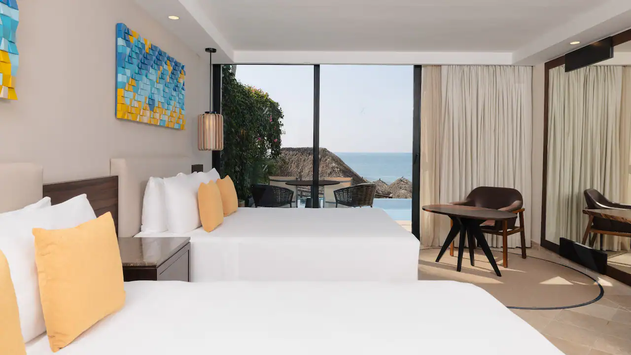 Swim-Up Double room with two double beds and ocean view terrace at Hyatt Ziva Puerto Vallarta.